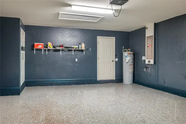 an empty room with closet and windows