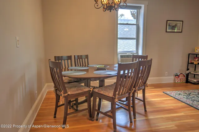 a view of a dining room with furniture and window