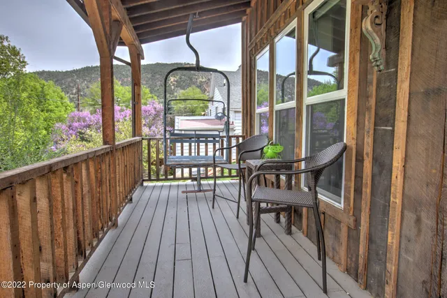 a view of a balcony with chairs