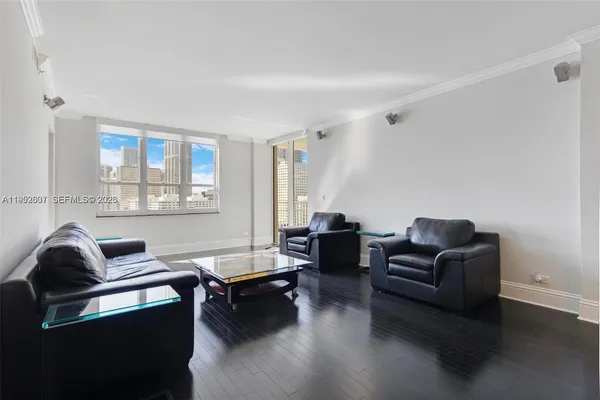 a living room with furniture and a window