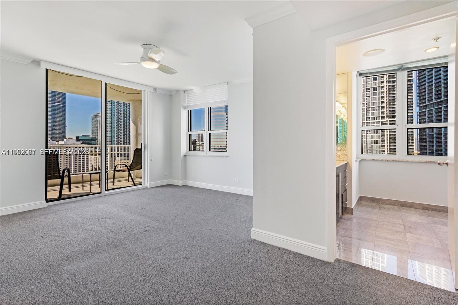 701 Brickell Key Boulevard, Unit 2103 Miami, FL 33131 - Photo 20 of 38 main bedroom with walk in closet and on suite