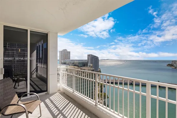 a view of a balcony with wooden floor