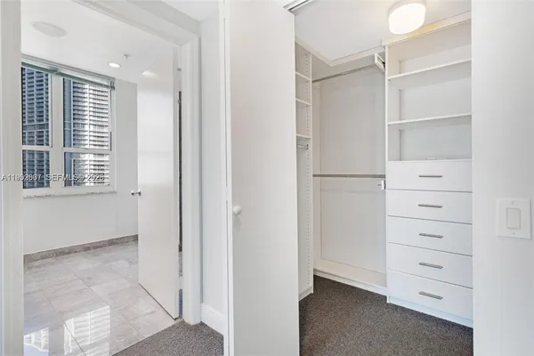 a bathroom with a shower and a toilet