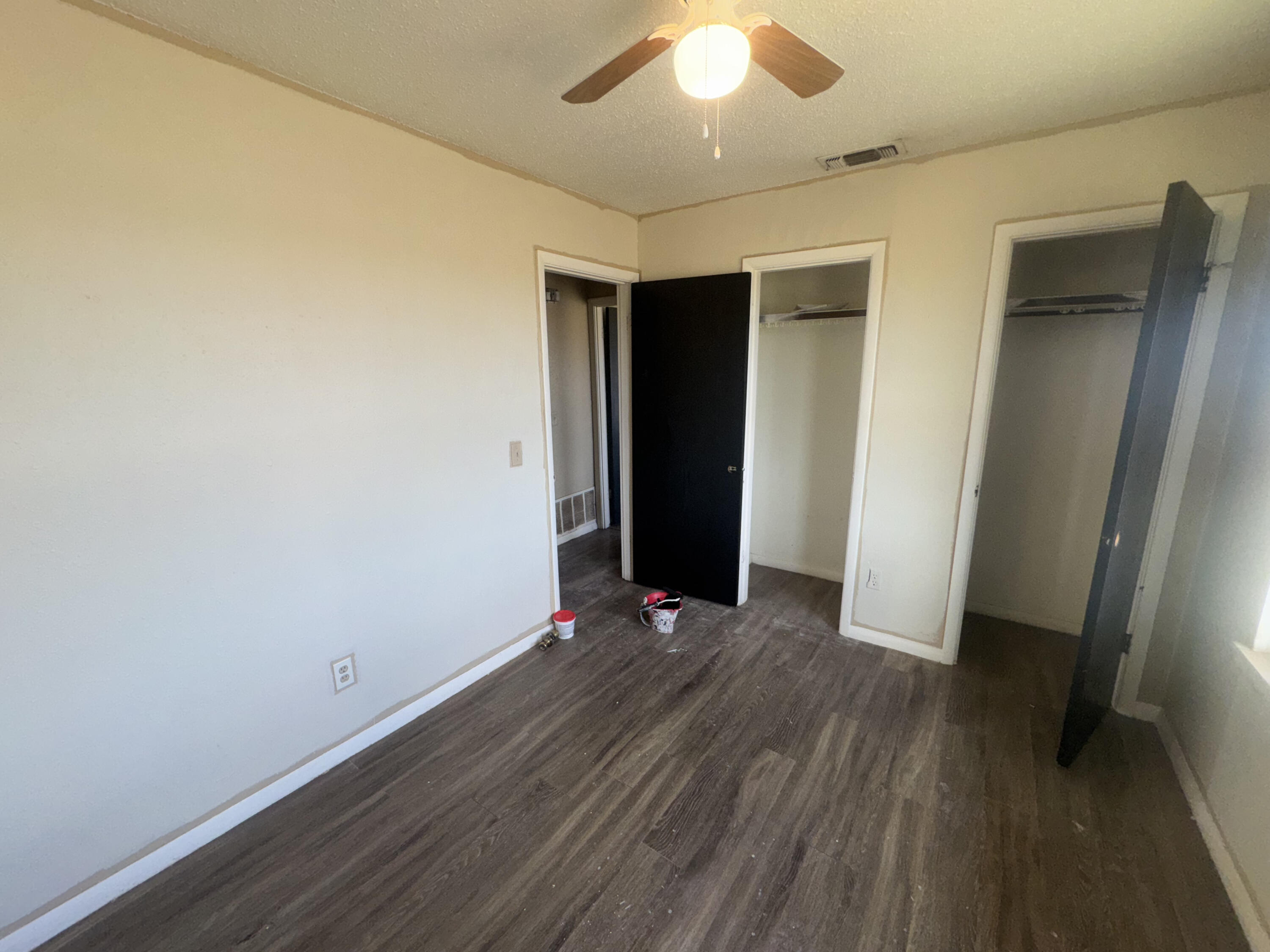105 Pecos Place Plainview, TX 79072 - Photo 6 of 14 an empty room with wooden floor and closet