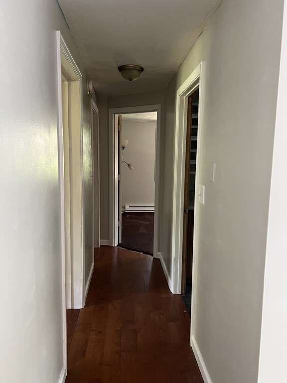 66 Carver Road Plymouth, MA 02360 - Photo 11 of 21 a view of a hallway with a wooden door