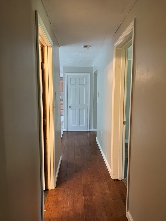 66 Carver Road Plymouth, MA 02360 - Photo 12 of 21 a view of a hallway with wooden floor and glass door