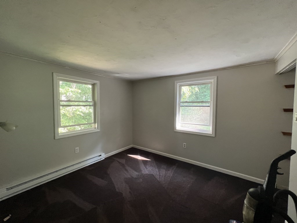 66 Carver Road Plymouth, MA 02360 - Photo 17 of 21 a view of a room with wooden floor and windows