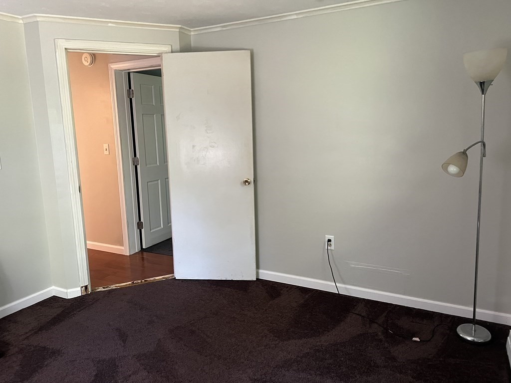 66 Carver Road Plymouth, MA 02360 - Photo 20 of 21 an empty room with wooden floor and closet