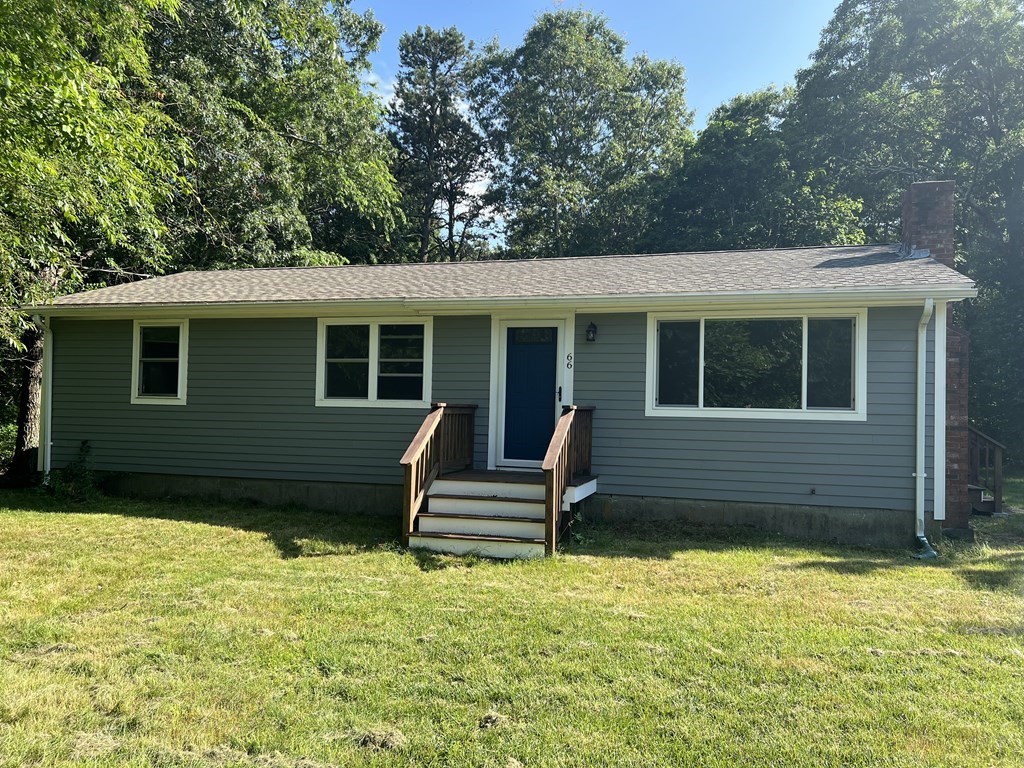 66 Carver Road Plymouth, MA 02360 - Photo 2 of 21 a front view of a house with a garden