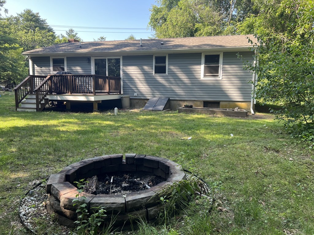 66 Carver Road Plymouth, MA 02360 - Photo 5 of 21 a front view of a house with a yard table and chairs