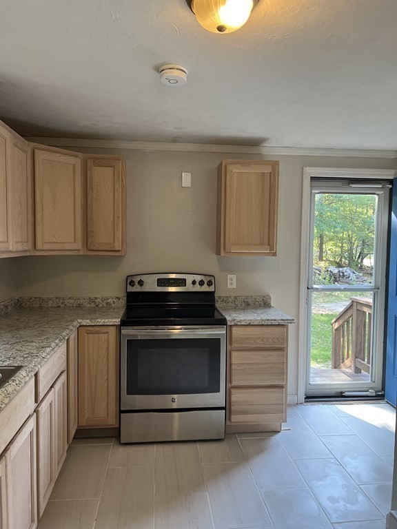 66 Carver Road Plymouth, MA 02360 - Photo 6 of 21 a kitchen with granite countertop a stove and a sink