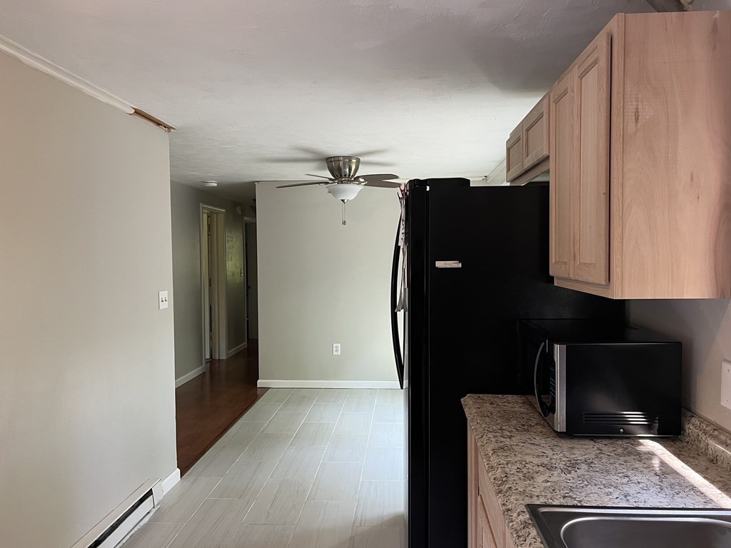 66 Carver Road Plymouth, MA 02360 - Photo 7 of 21 a kitchen with a refrigerator and a stove