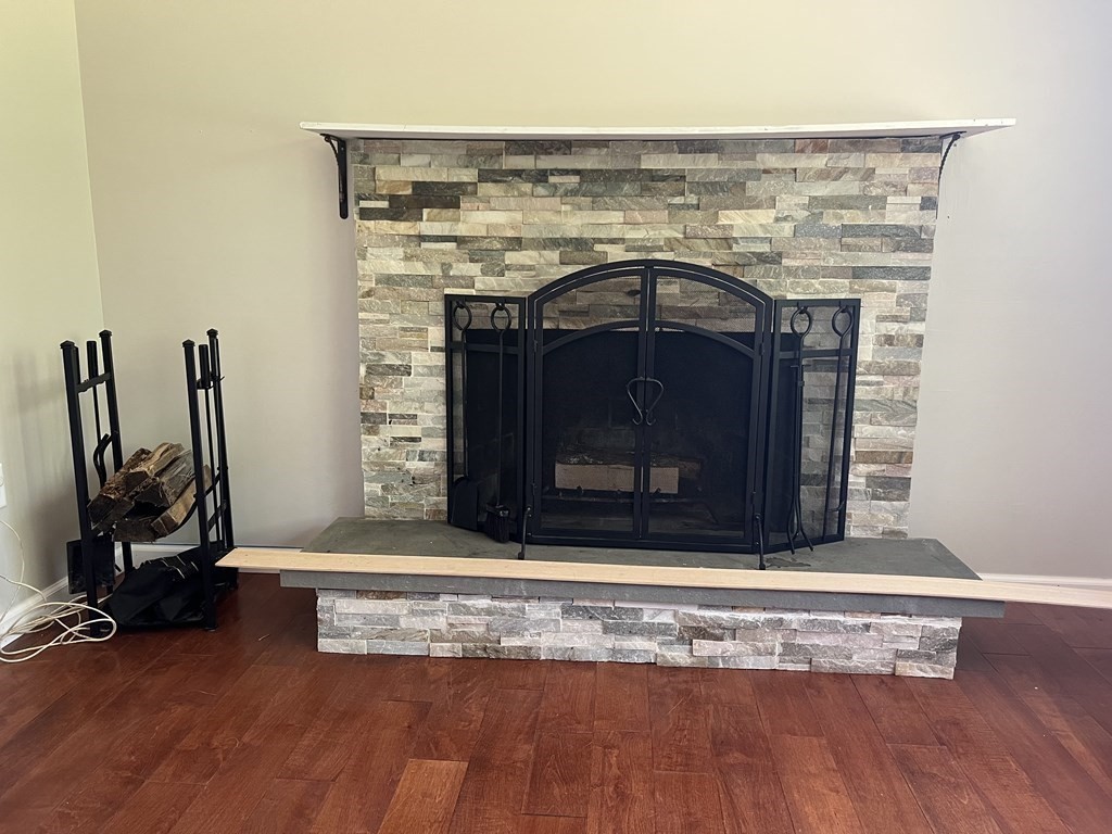 66 Carver Road Plymouth, MA 02360 - Photo 9 of 21 a view of fireplace in room with wooden floor