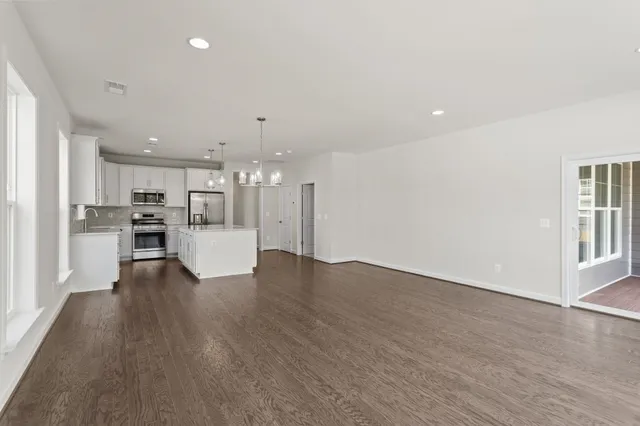 a view of a balcony with wooden floor