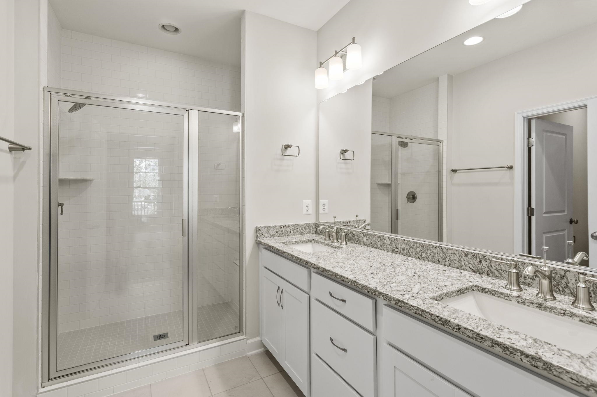 2784 Rutlege Road, Unit 188 Harrisonburg, VA 22801 - Photo 14 of 30 a bathroom with a granite countertop sink mirror and shower
