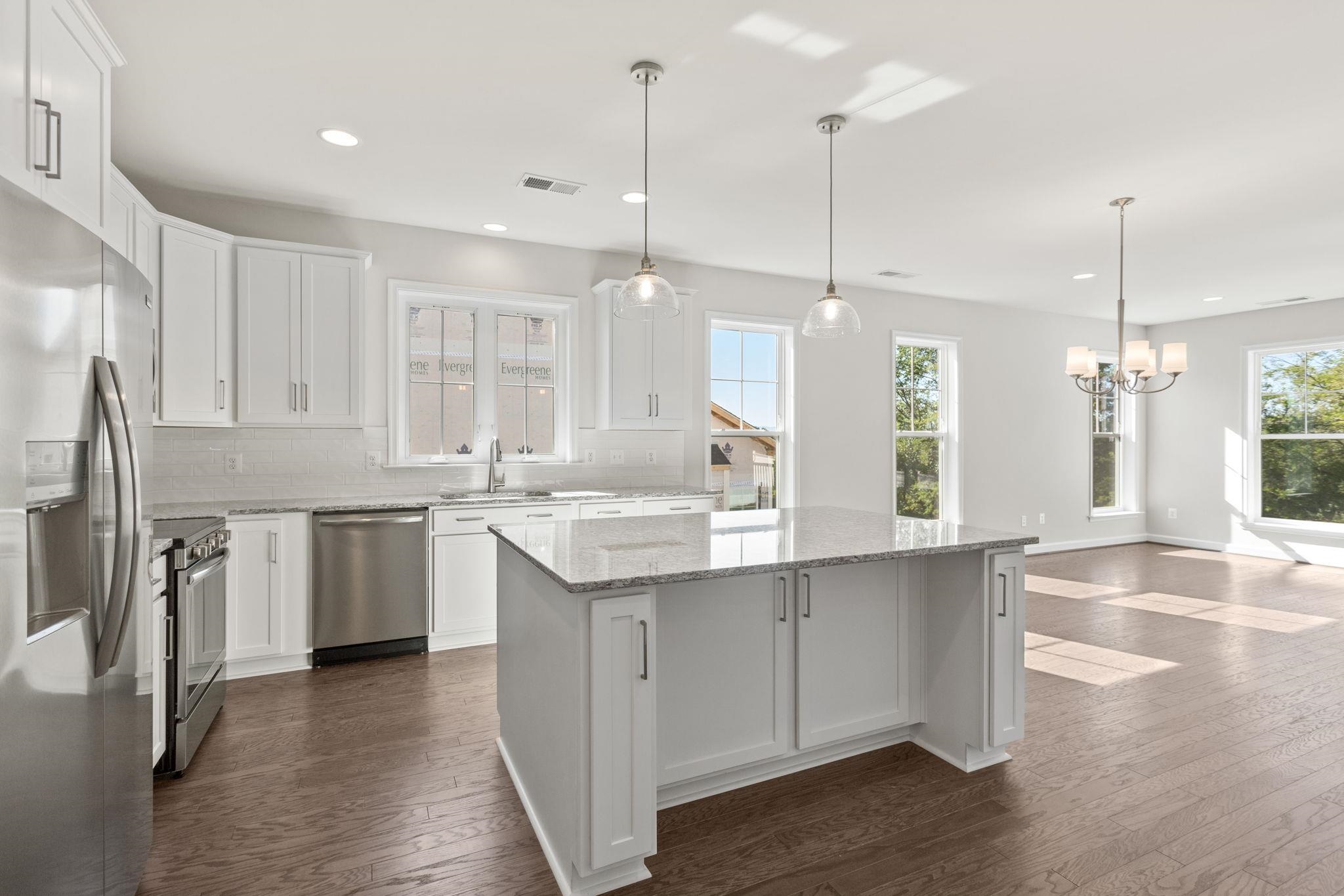 2784 Rutlege Road, Unit 188 Harrisonburg, VA 22801 - Photo 27 of 30 a kitchen with kitchen island granite countertop a sink a counter space appliances and cabinets