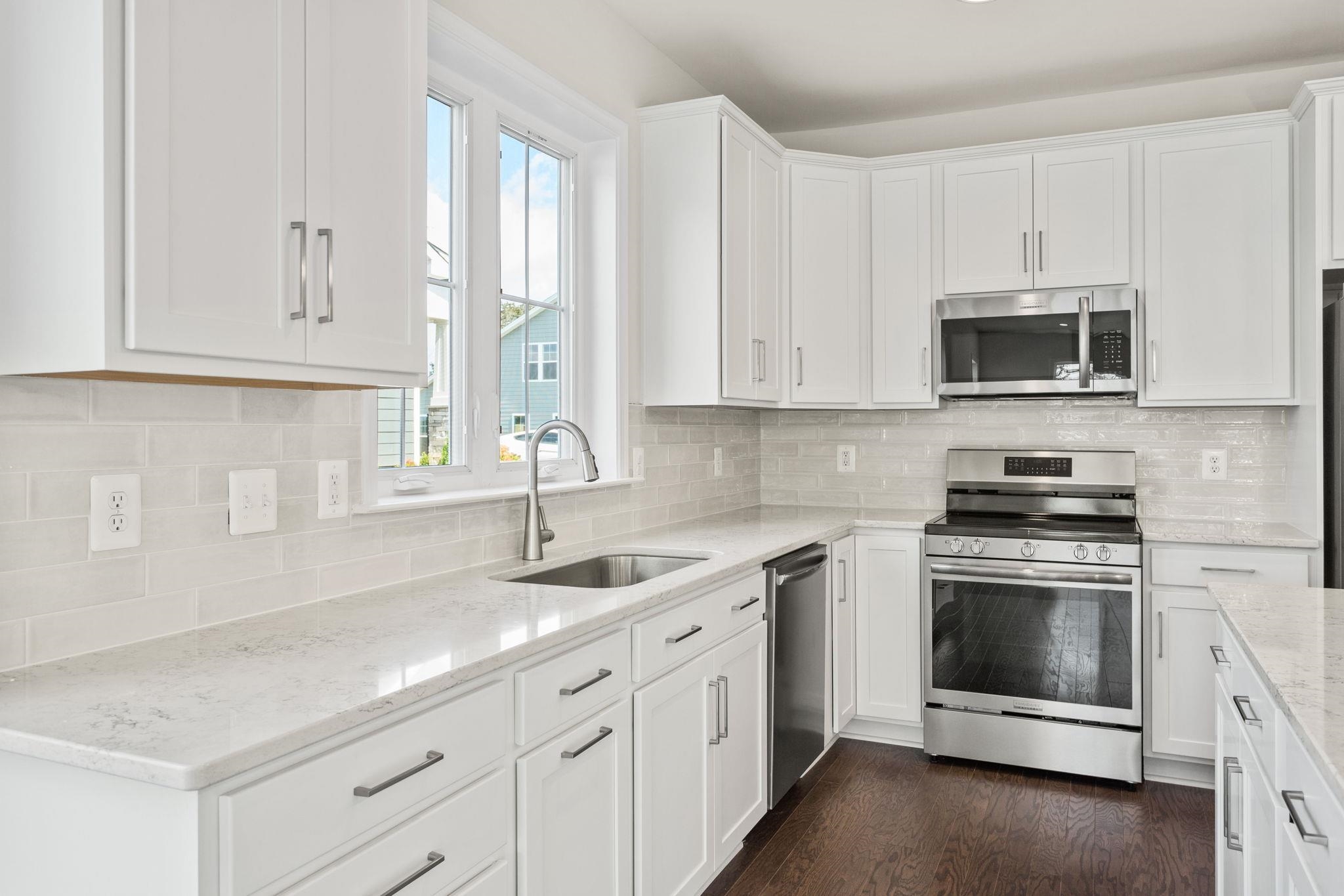 2784 Rutlege Road, Unit 188 Harrisonburg, VA 22801 - Photo 7 of 31 a kitchen with white cabinets and white appliances