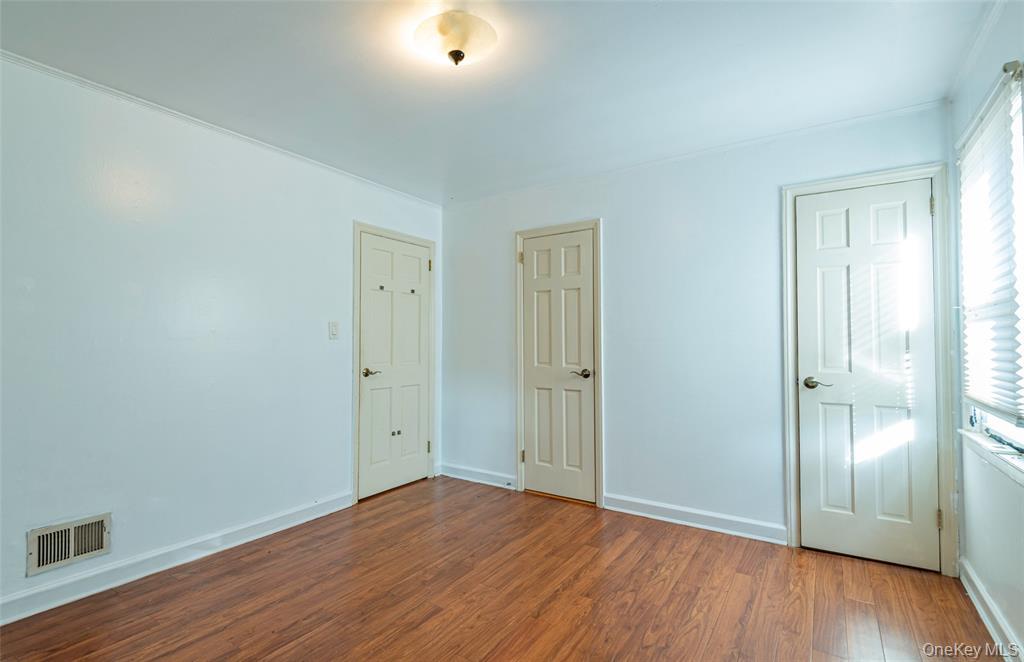 78-36 271st Street Queens, NY 11040 - Photo 8 of 17 a view of an empty room with wooden floor