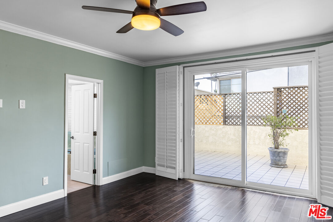 818 6th Street, Unit 102 Santa Monica, CA 90403 - Photo 20 of 29 a view of an empty room with wooden floor and a window