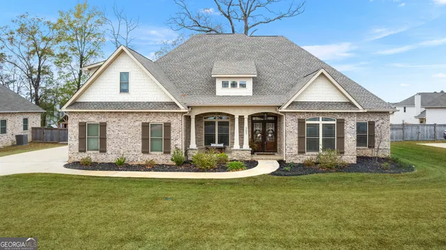 a front view of a house with a yard