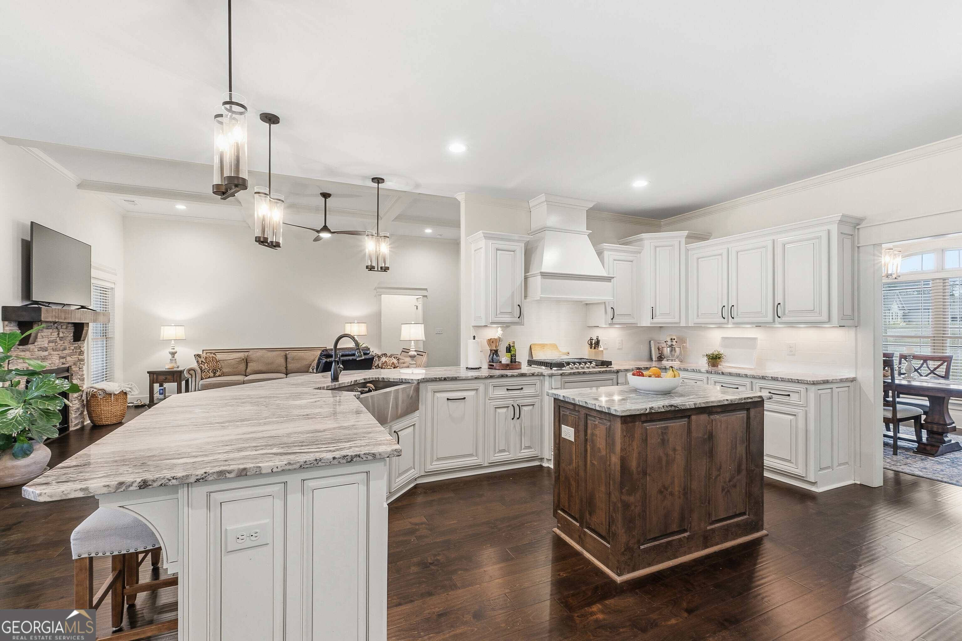 307 Apalachee Way Bonaire, GA 31005 - Photo 20 of 61 a kitchen with a stove a sink a counter space and wooden floor