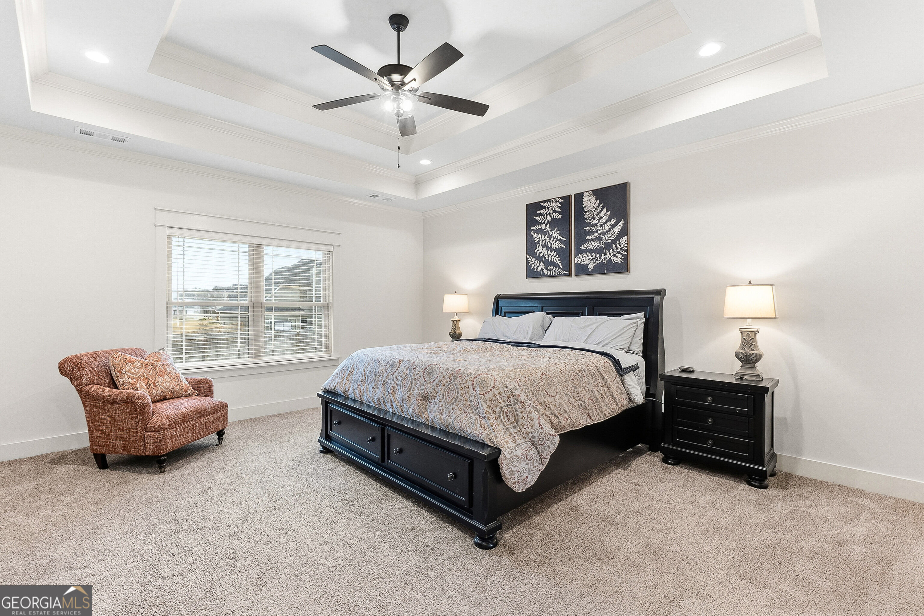 307 Apalachee Way Bonaire, GA 31005 - Photo 30 of 61 a spacious bedroom with a bed and a couch