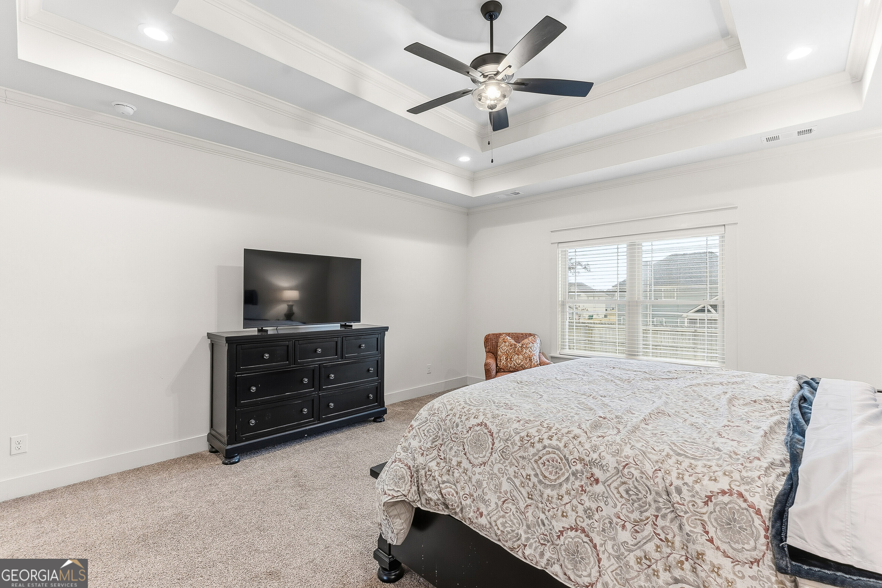 307 Apalachee Way Bonaire, GA 31005 - Photo 32 of 61 a bedroom with a bed and a flat screen tv