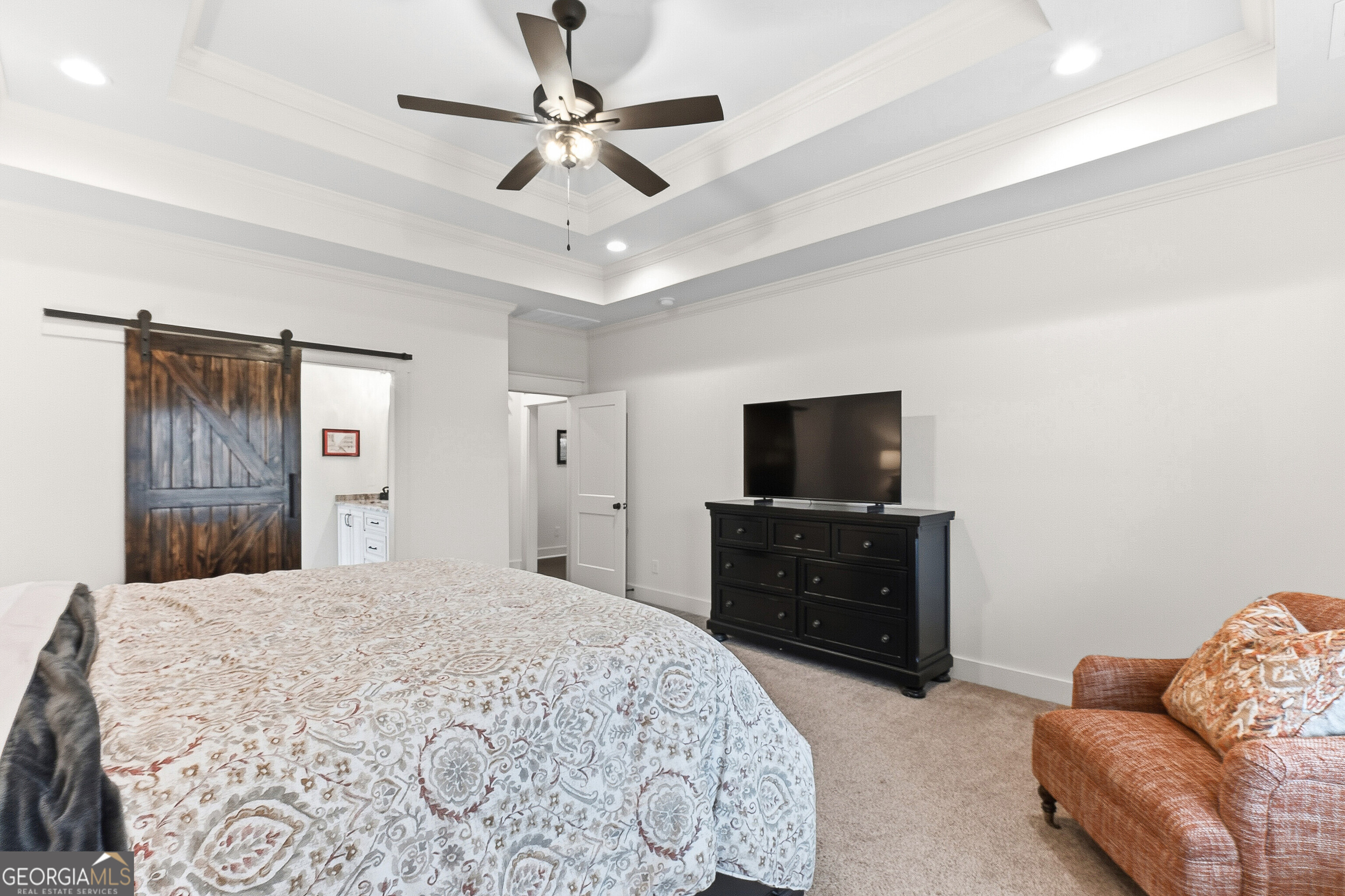 307 Apalachee Way Bonaire, GA 31005 - Photo 33 of 61 a bedroom with a bed and a television