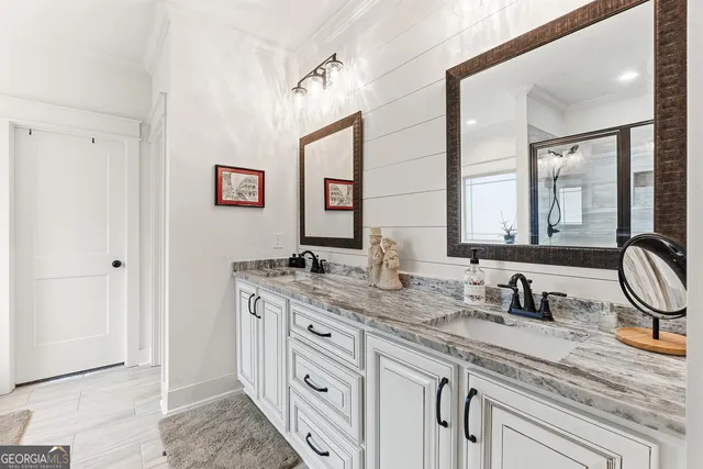 a view of walk in closet with clothes