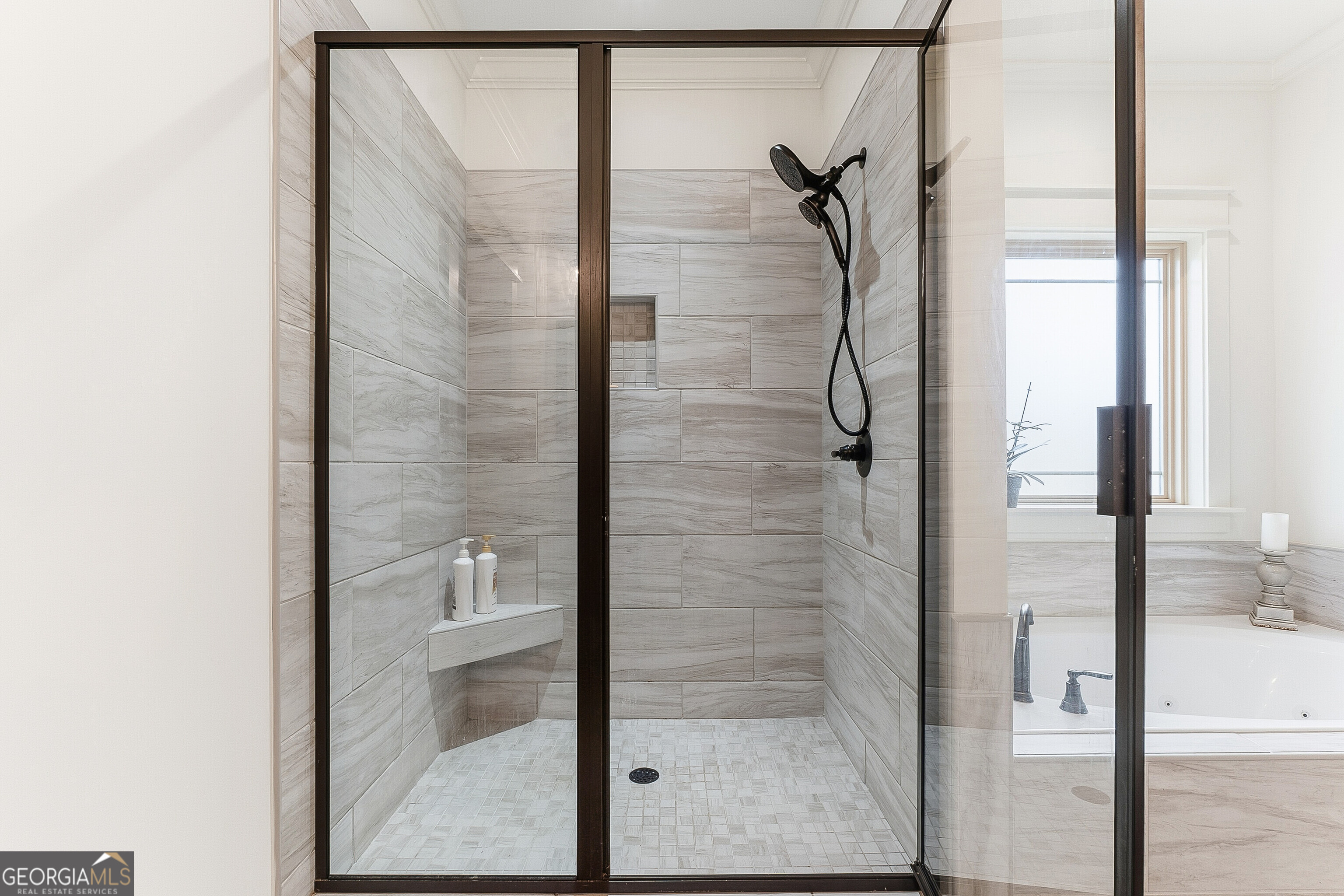 307 Apalachee Way Bonaire, GA 31005 - Photo 38 of 61 a bathroom with a glass shower door