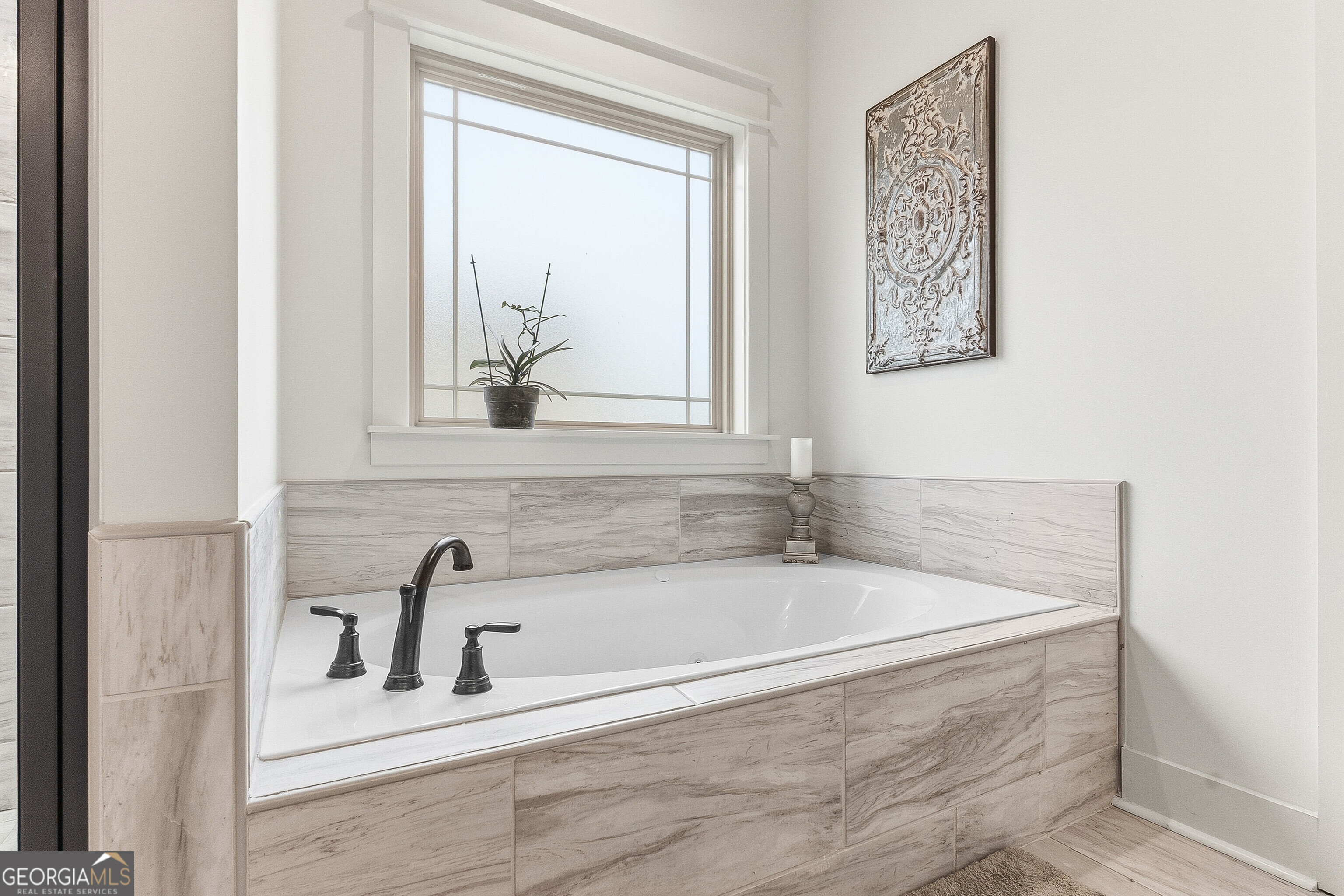 307 Apalachee Way Bonaire, GA 31005 - Photo 39 of 61 a white bath tub sitting next to a window