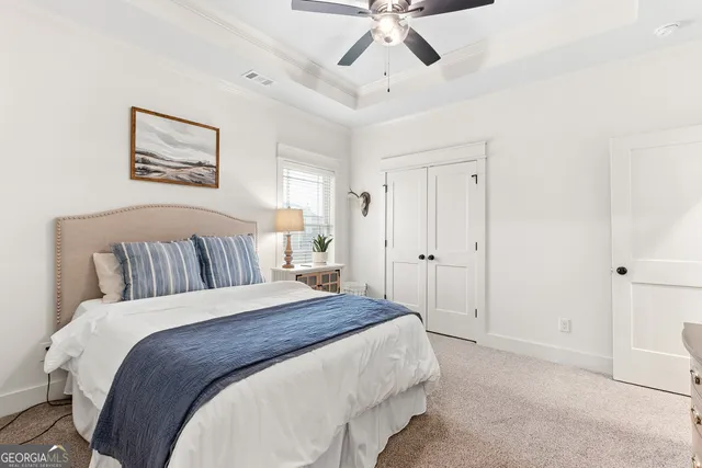 a bathroom with a granite countertop sink toilet and mirror
