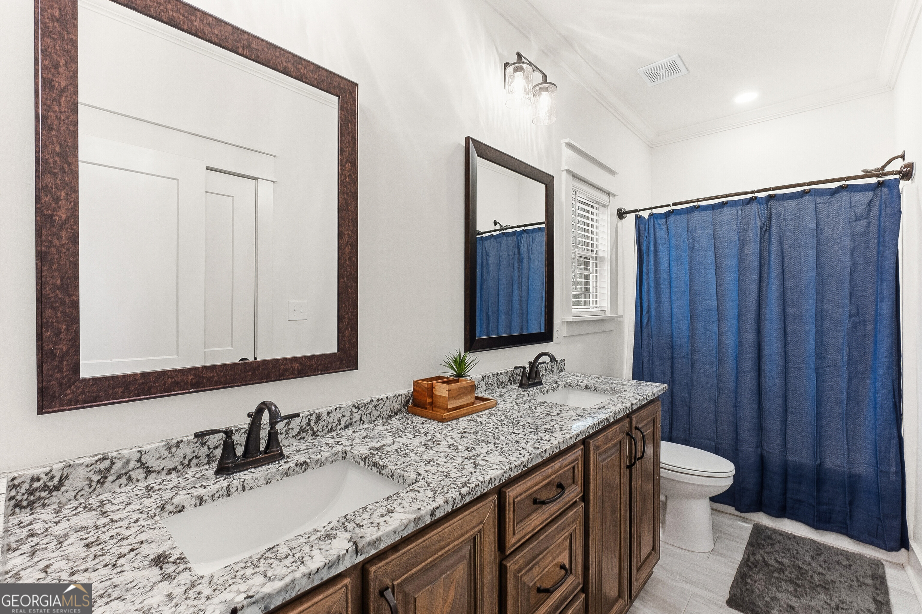 307 Apalachee Way Bonaire, GA 31005 - Photo 44 of 61 a bathroom with a granite countertop sink and a mirror