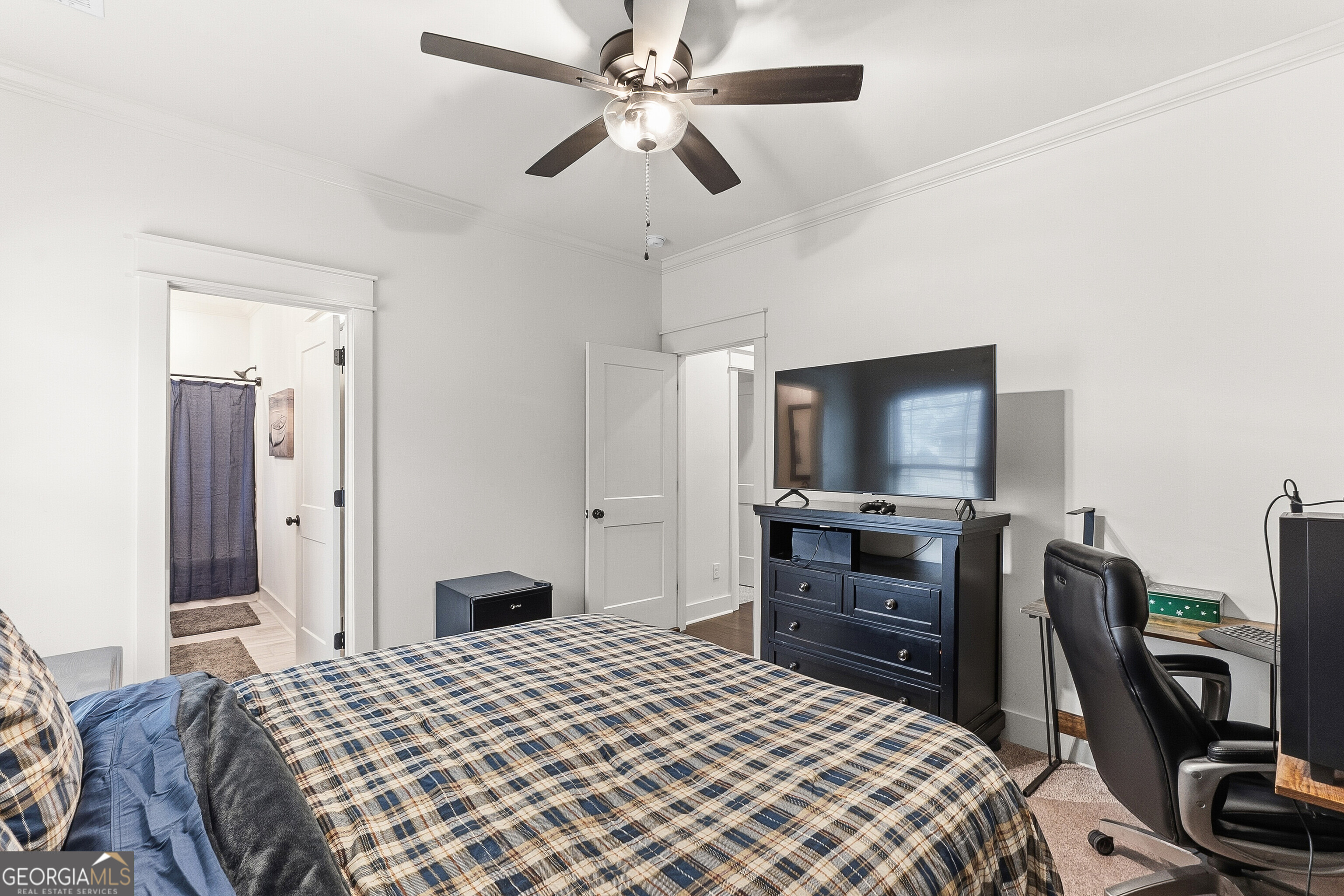 307 Apalachee Way Bonaire, GA 31005 - Photo 46 of 61 a bedroom with a bed and a flat screen tv