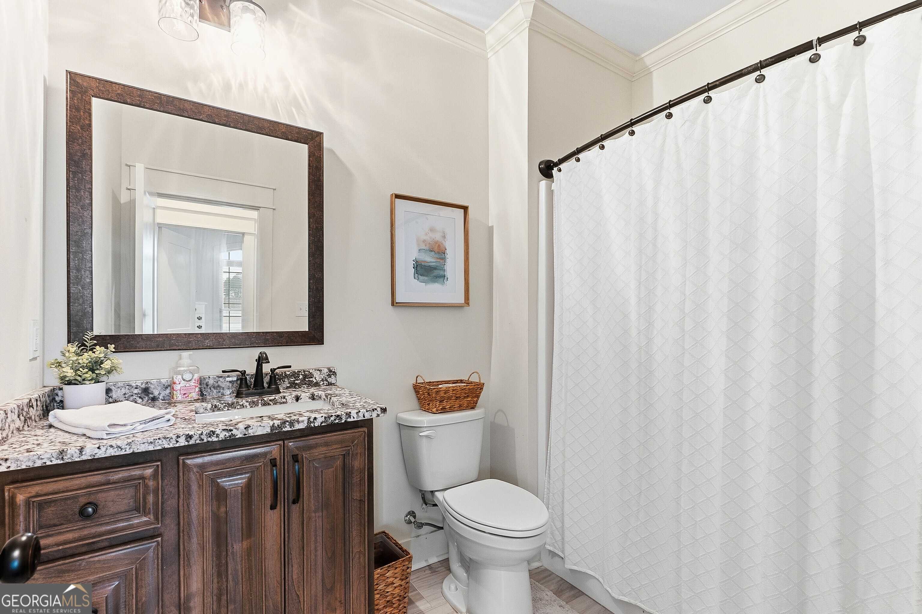 307 Apalachee Way Bonaire, GA 31005 - Photo 50 of 61 a bathroom with a granite countertop sink toilet and mirror