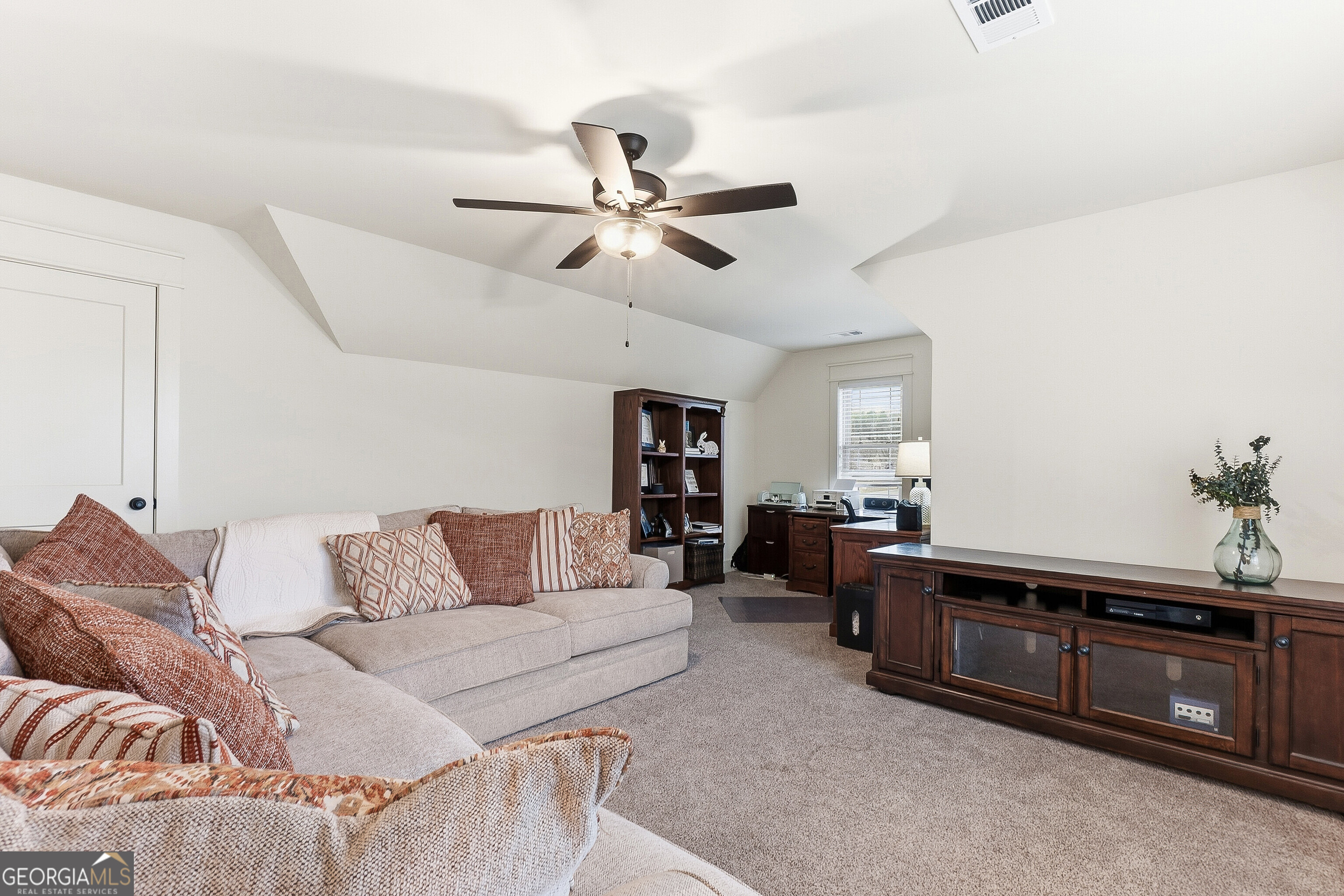 307 Apalachee Way Bonaire, GA 31005 - Photo 51 of 61 a living room with furniture and wooden floor