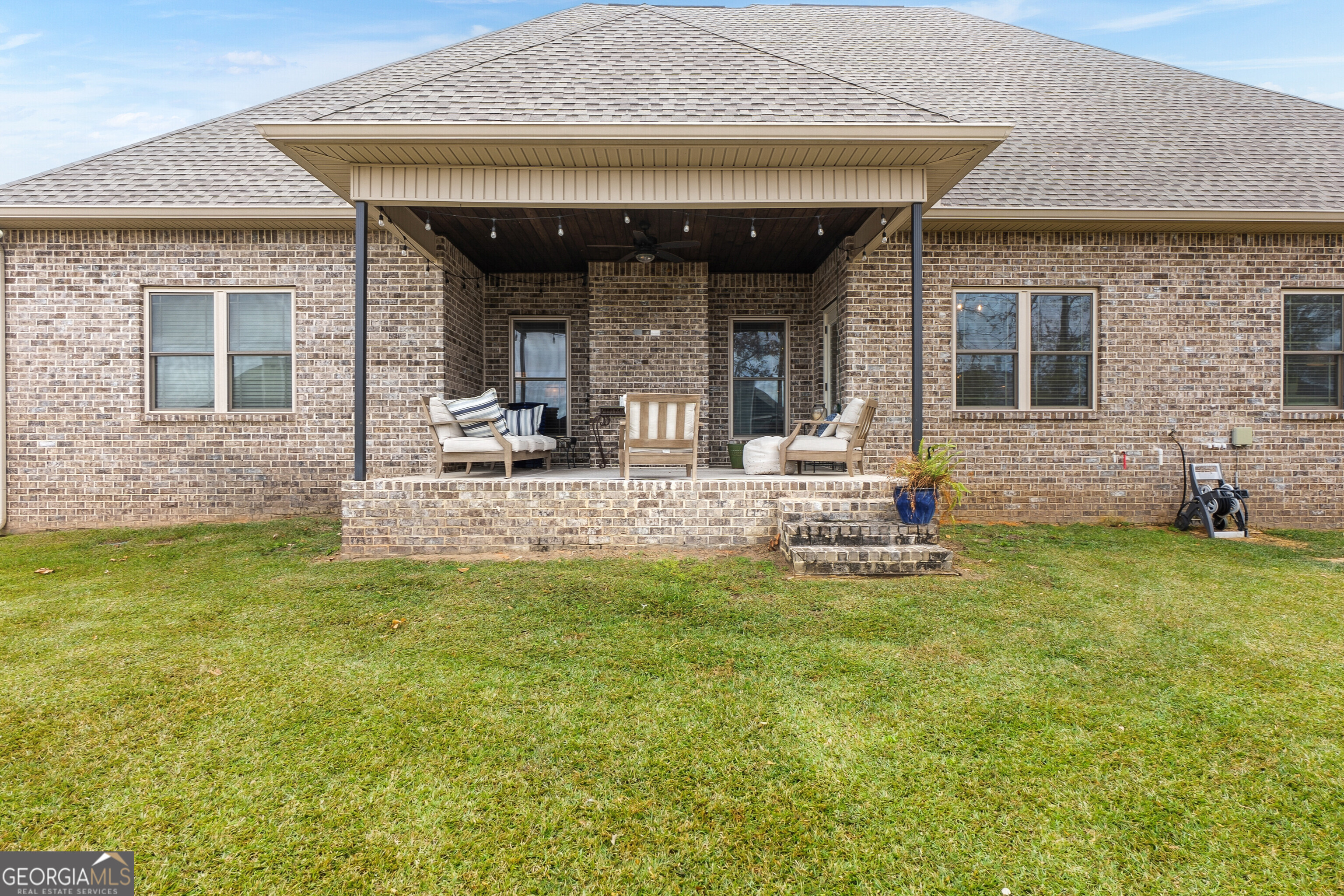 307 Apalachee Way Bonaire, GA 31005 - Photo 56 of 61 a view of a house with a patio and a yard