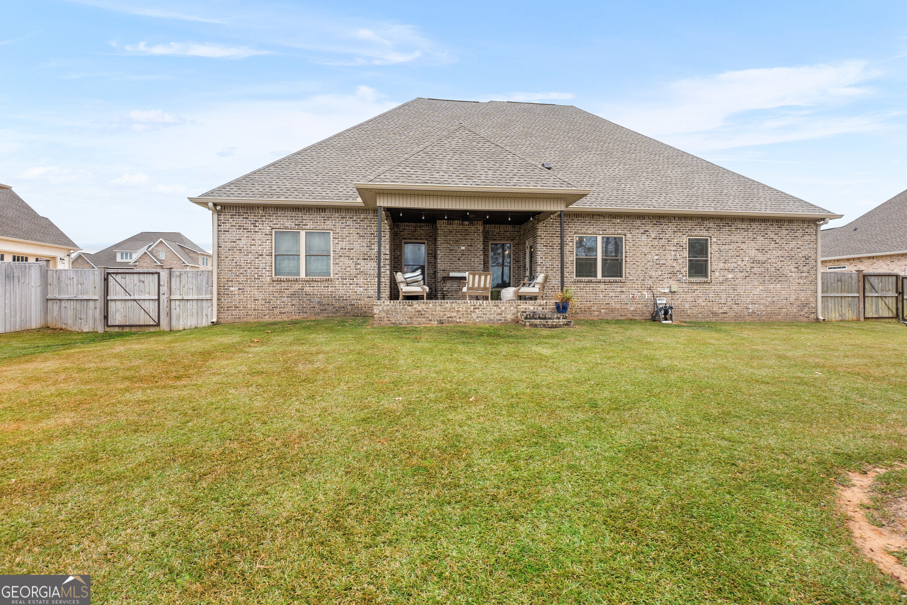307 Apalachee Way Bonaire, GA 31005 - Photo 59 of 61 a view of a house with a yard and sitting area
