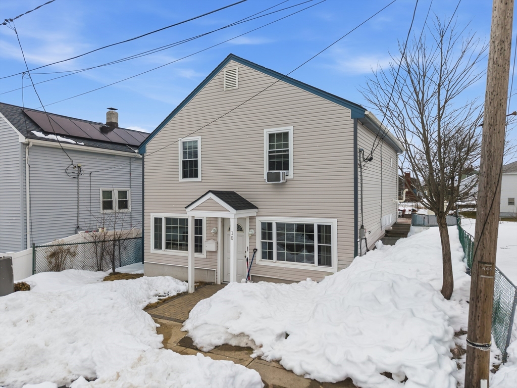10 Aberdeen Street Fall River, MA 02721 - Photo 2 of 35 a front view of a house with a yard outdoor seating and garage