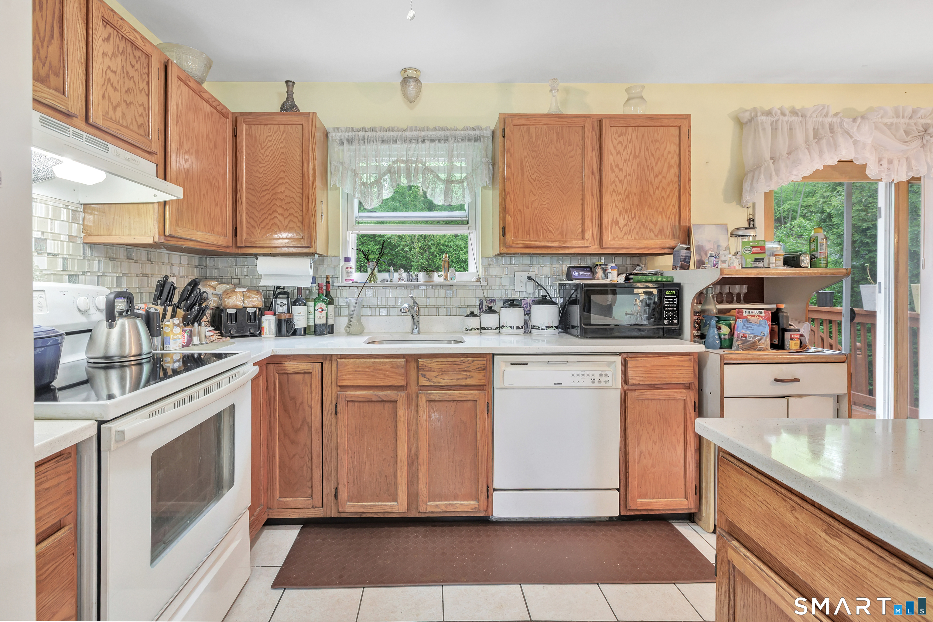123 River Road Shelton, CT 06484 - Photo 7 of 27 a kitchen with stainless steel appliances granite countertop a sink a stove and cabinets