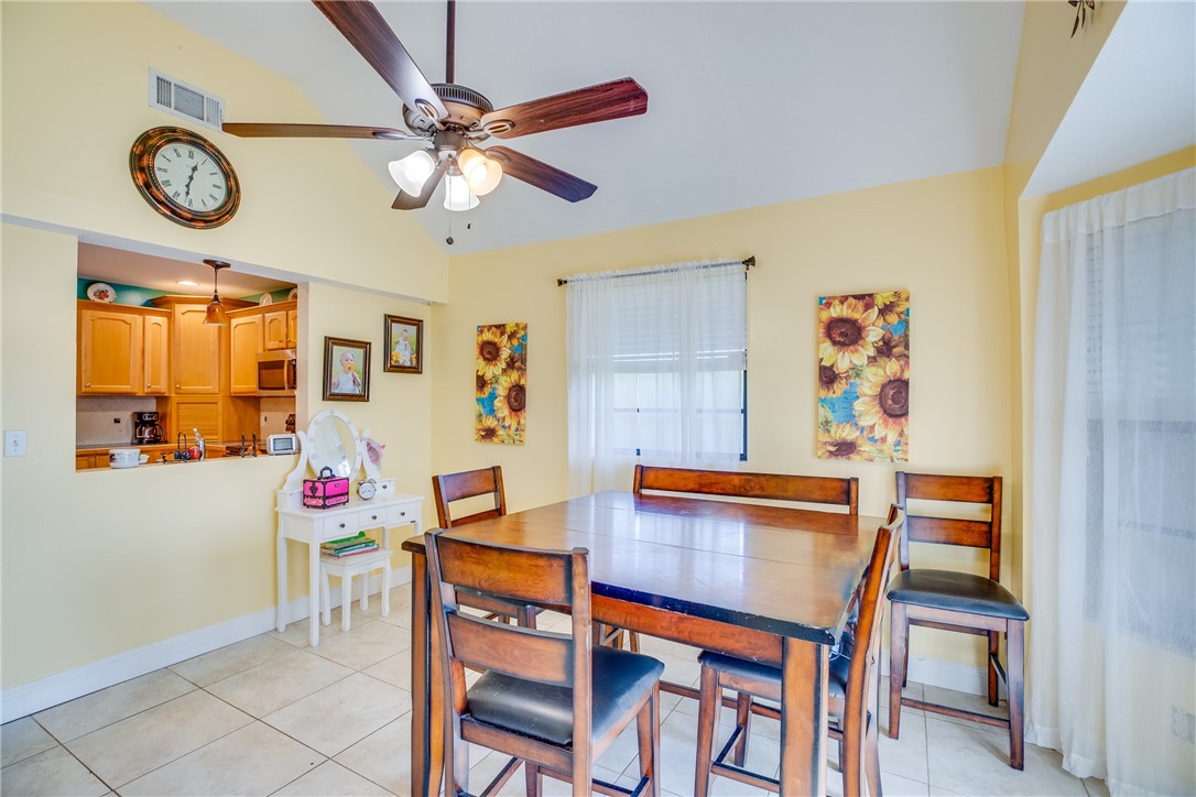 474 Azine Terrace Sebastian, FL 32958 - Photo 13 of 33 a view of a dining room with furniture and a chandelier fan