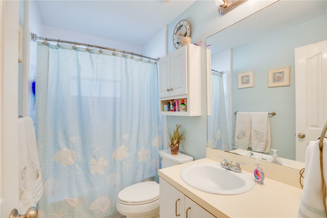 474 Azine Terrace Sebastian, FL 32958 - Photo 19 of 33 a bathroom with a sink toilet and shower