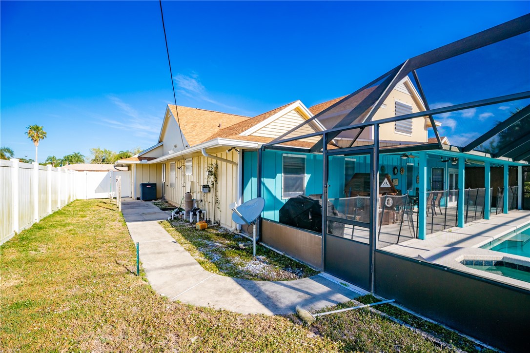 474 Azine Terrace Sebastian, FL 32958 - Photo 27 of 33 a view of a house with backyard and porch