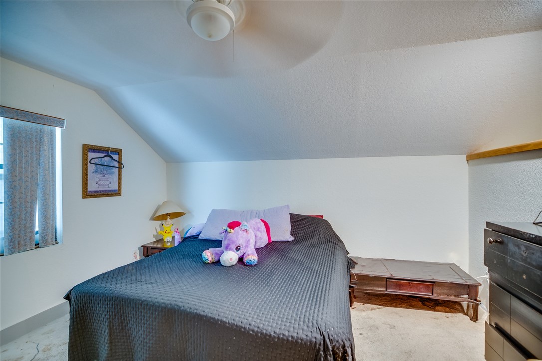 474 Azine Terrace Sebastian, FL 32958 - Photo 30 of 33 a bedroom with furniture and a baby crib