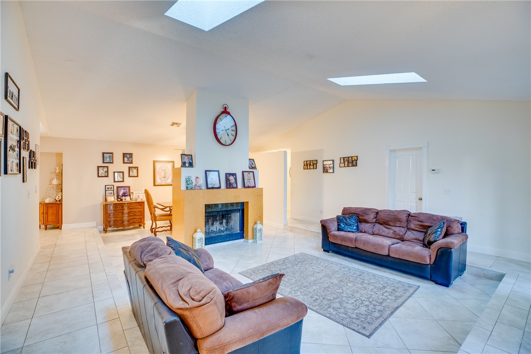 474 Azine Terrace Sebastian, FL 32958 - Photo 3 of 33 a living room with furniture and a fireplace