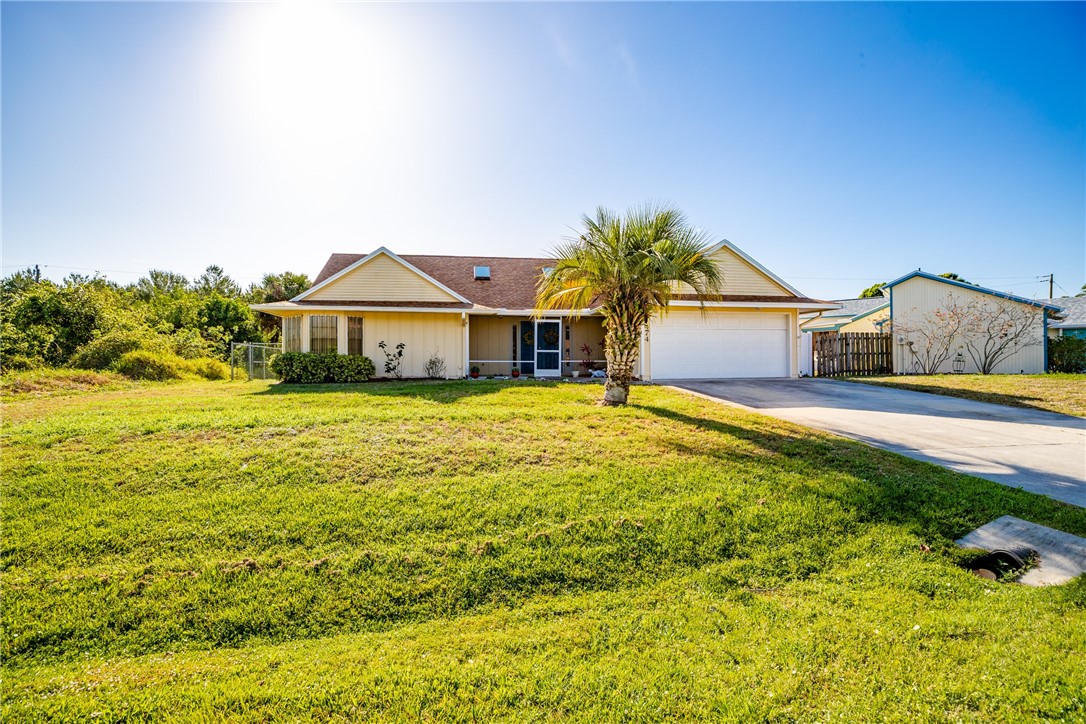 474 Azine Terrace Sebastian, FL 32958 - Photo 32 of 33 a front view of a house with garden