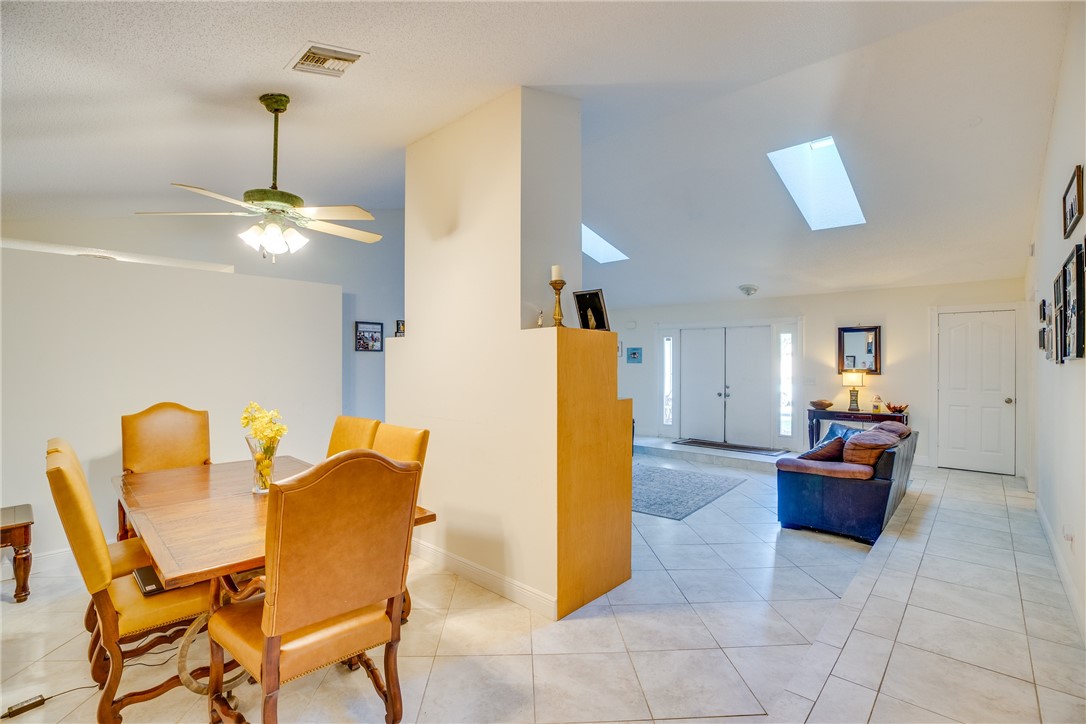 474 Azine Terrace Sebastian, FL 32958 - Photo 6 of 33 a dining room with furniture and a chandelier
