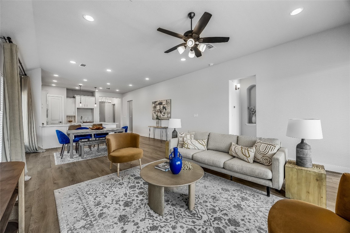 200 Grn Knl Lane Georgetown, TX 78628 - Photo 12 of 32 a living room with furniture and a chandelier