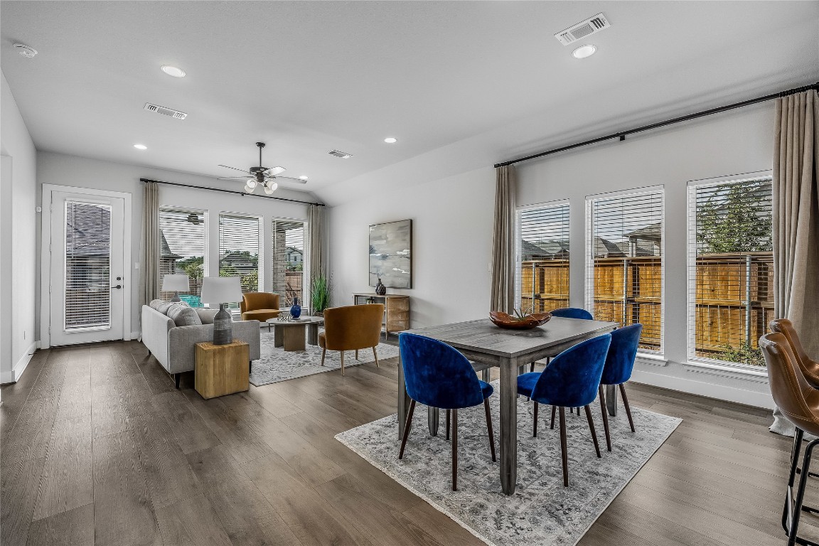 200 Grn Knl Lane Georgetown, TX 78628 - Photo 10 of 32 a view of a dining room with furniture window and wooden floor