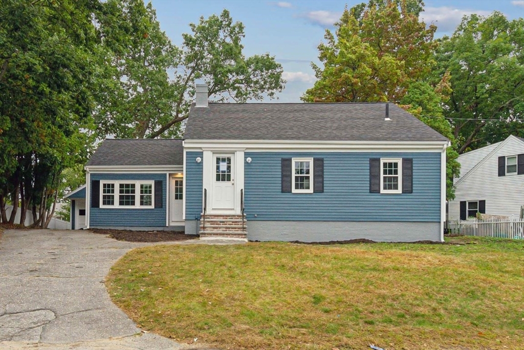 1 Arbor Road North Chelmsford, MA 01863 - Photo 1 of 40 a front view of a house with a garden